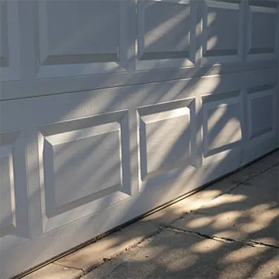 Porte de garage à Lyon – Volets Lyonnais, installation sectionnelle, enroulable ou motorisée